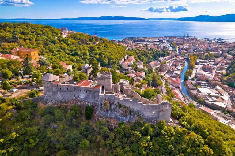Aerial shot of Rijeka, Croatia and surrounding forest and sea