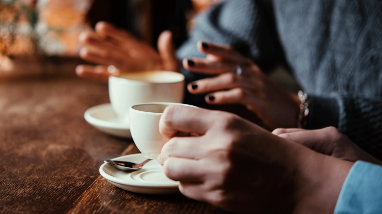 2-woman-drinking-coffee-cafe