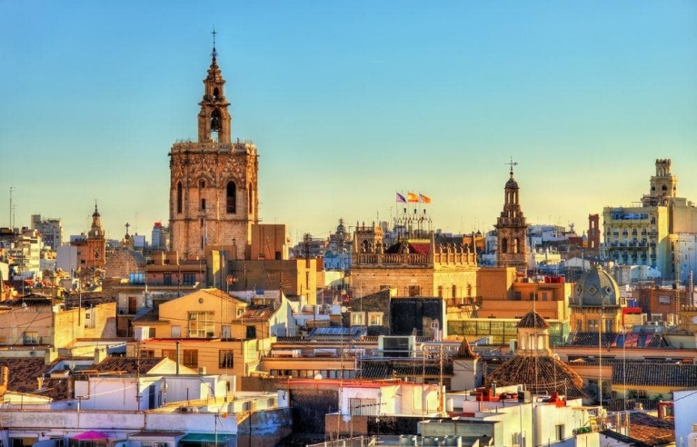 Many golden-toned buildings bathed in low sunlight 