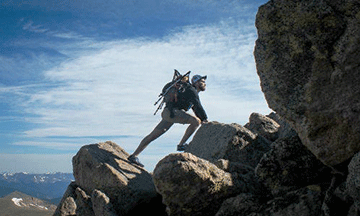 man-climbing-rocks-mountains