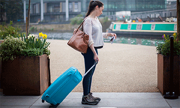 stasher-benefit-girl-with-suitcase